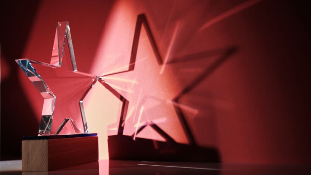 Crystal trophy against red background