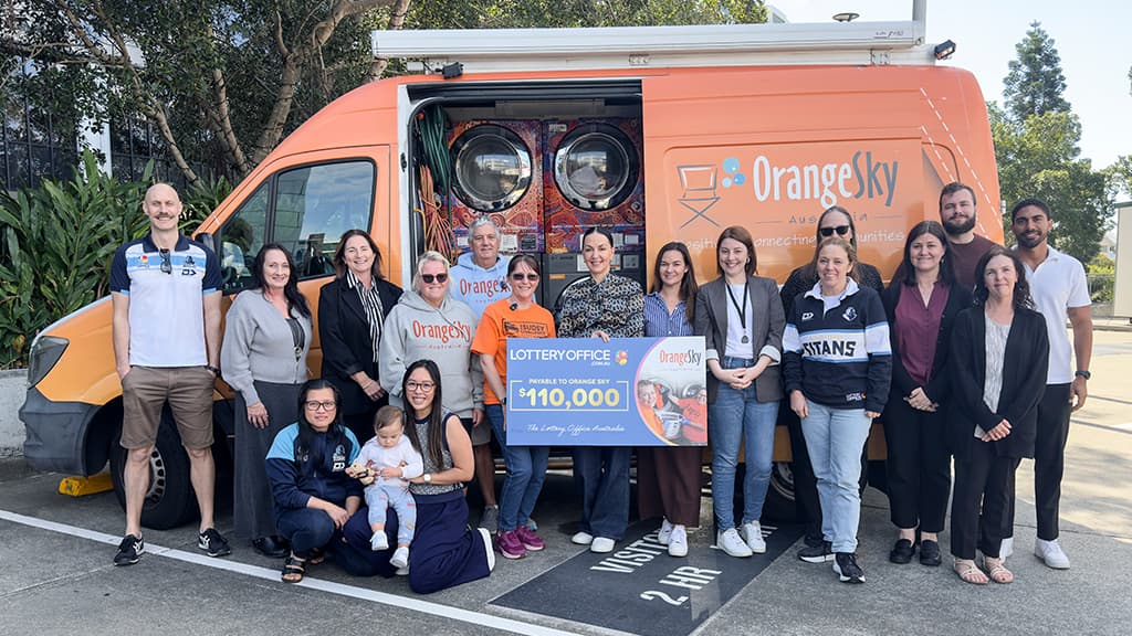 Team photo with the Orange Sky volunteers