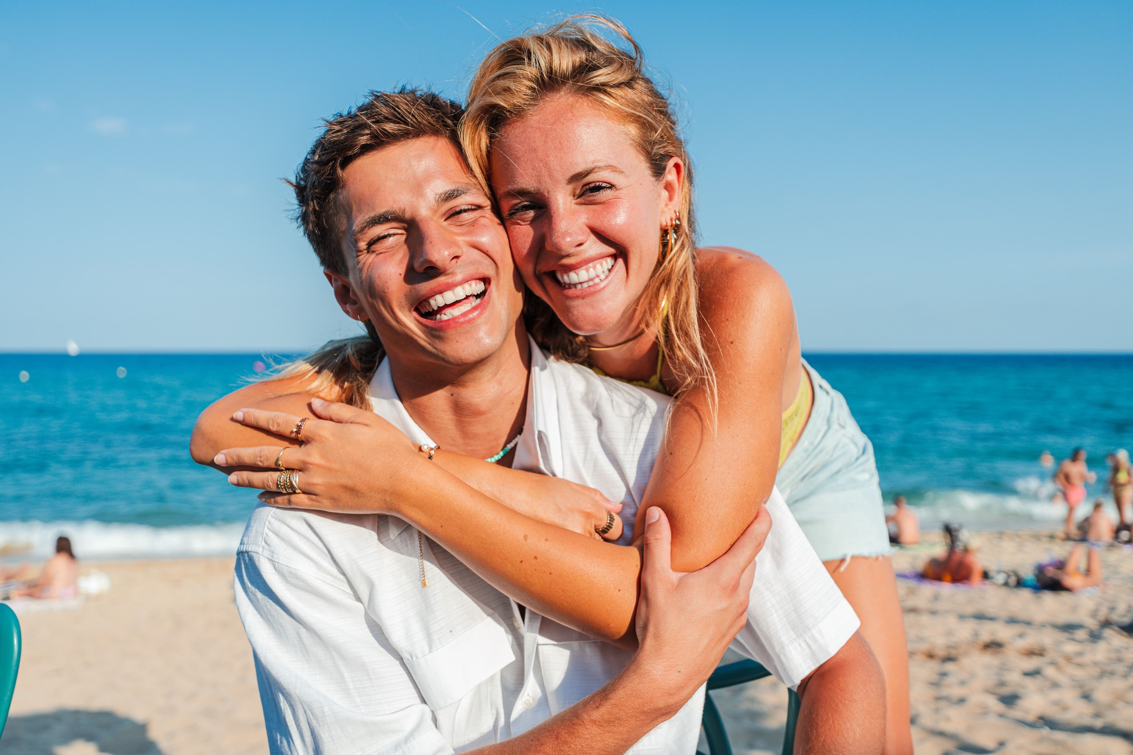 Close up portrait of a young Caucasian tourist couple hugging