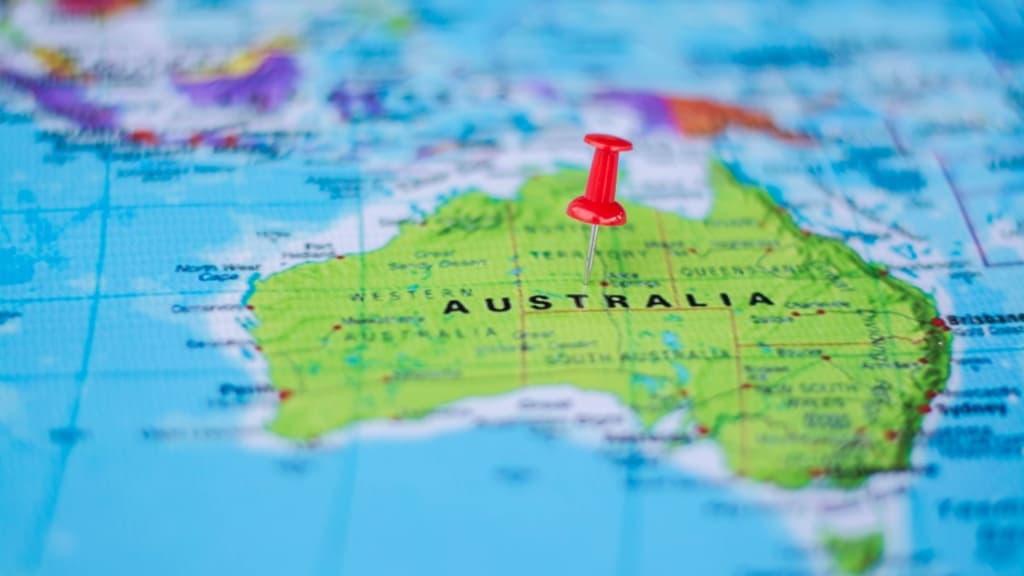 Pushpin marking the location Australia on a map.