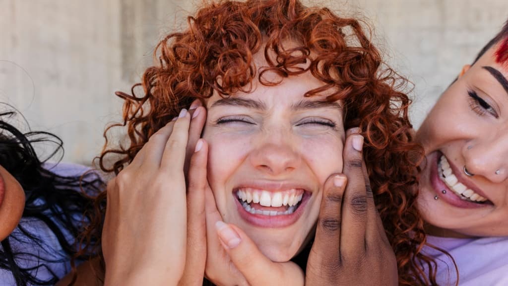 Young happy woman celebrating with a group of friends.