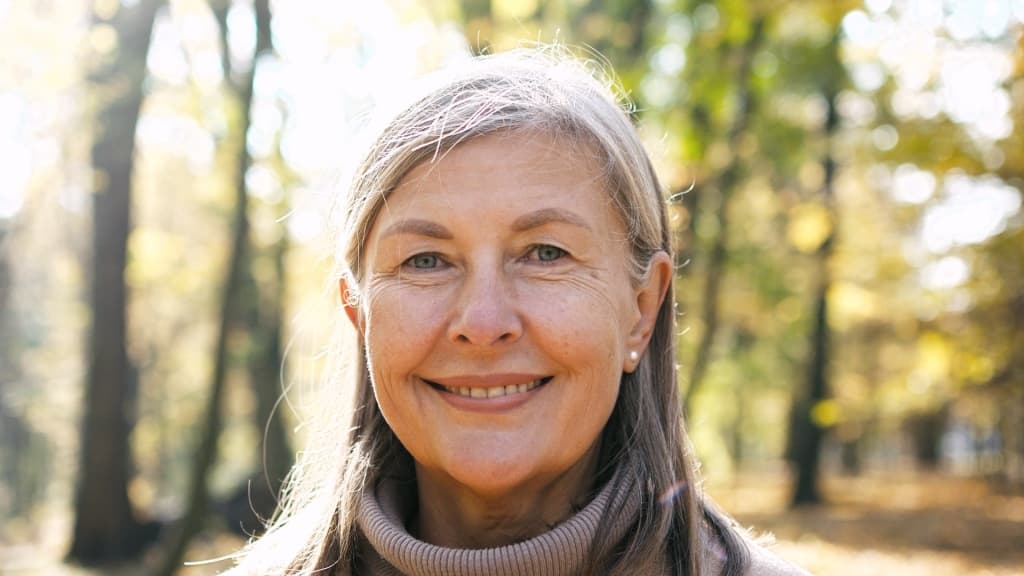 Close-up portrait of naturally beautiful senior gray-haired woman