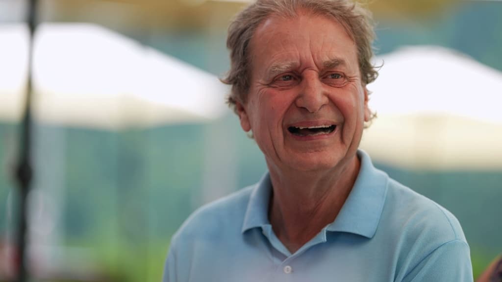 Mature man smiling.
