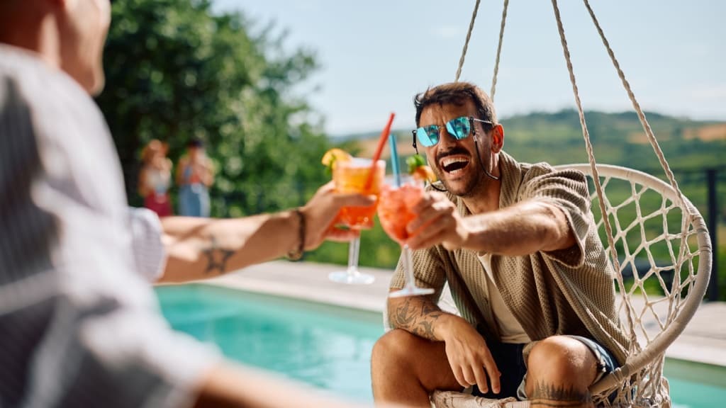 Young man celebrating with a friend.